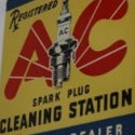 AC Spark Plugs 1926 tin die-cut flange sign brings new $2,310 record