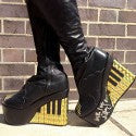 Elton John's platform boots to auction for Amnesty International