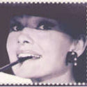 Smokin'! £403,000 for a sheet of stamps showing Audrey Hepburn with a cigarette