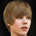 Hair today, gone tomorrow... Teen star Justin Bieber reaches for the scissors