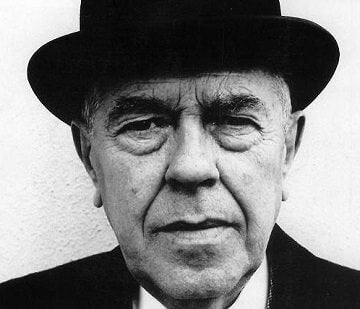 photo portrait of surrealist Belgian artist Rene Magritte