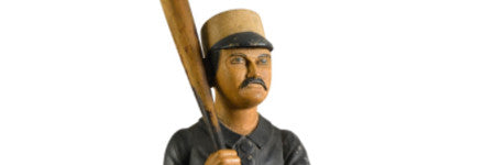 Carved baseball player figure starring at Sotheby’s