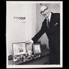 A photograph of Mr Crisp holding a framed image of the Royal Family