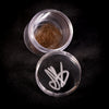 Justin Bieber's hair, presented in a plastic container which has been initialled by Bieber himself. 