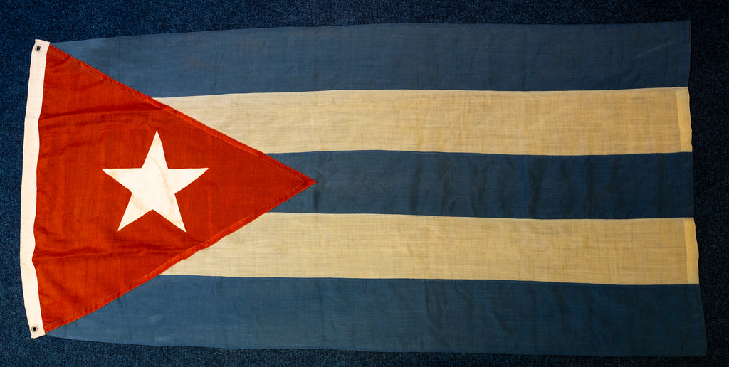 Che Guevara’s personally owned, signed and inscribed Bay of Pigs victory Cuba flag